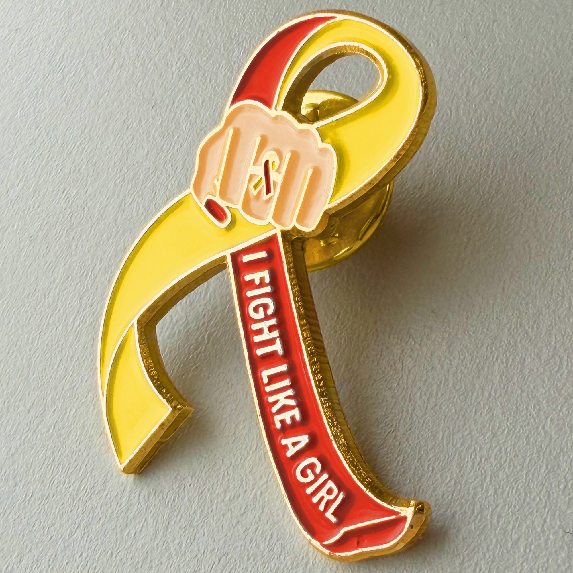 I Fight Like a Girl Fist Awareness Ribbon Lapel Pin - Red/Yellow