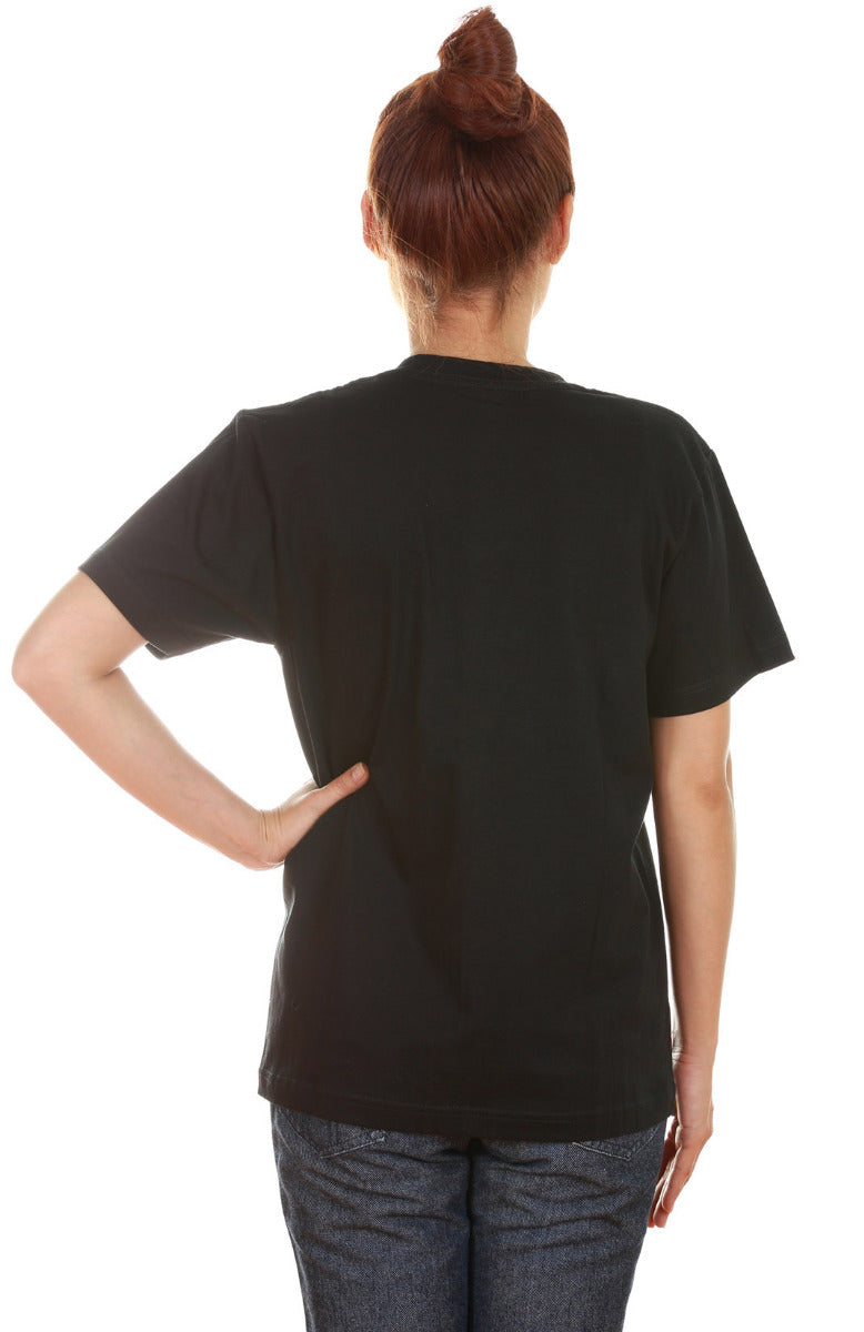 Back of woman wearing a black unisex t-shirt. The back of the shirt doesn't have any artwork printed on it.