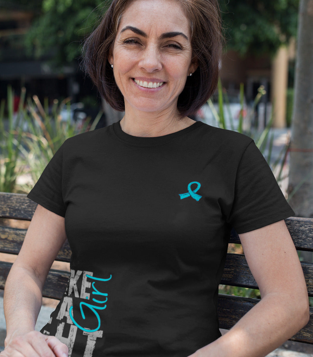 Woman wearing a black women's fit t-shirt with the Fight Like a Girl Side Wrap design in teal printed on it.