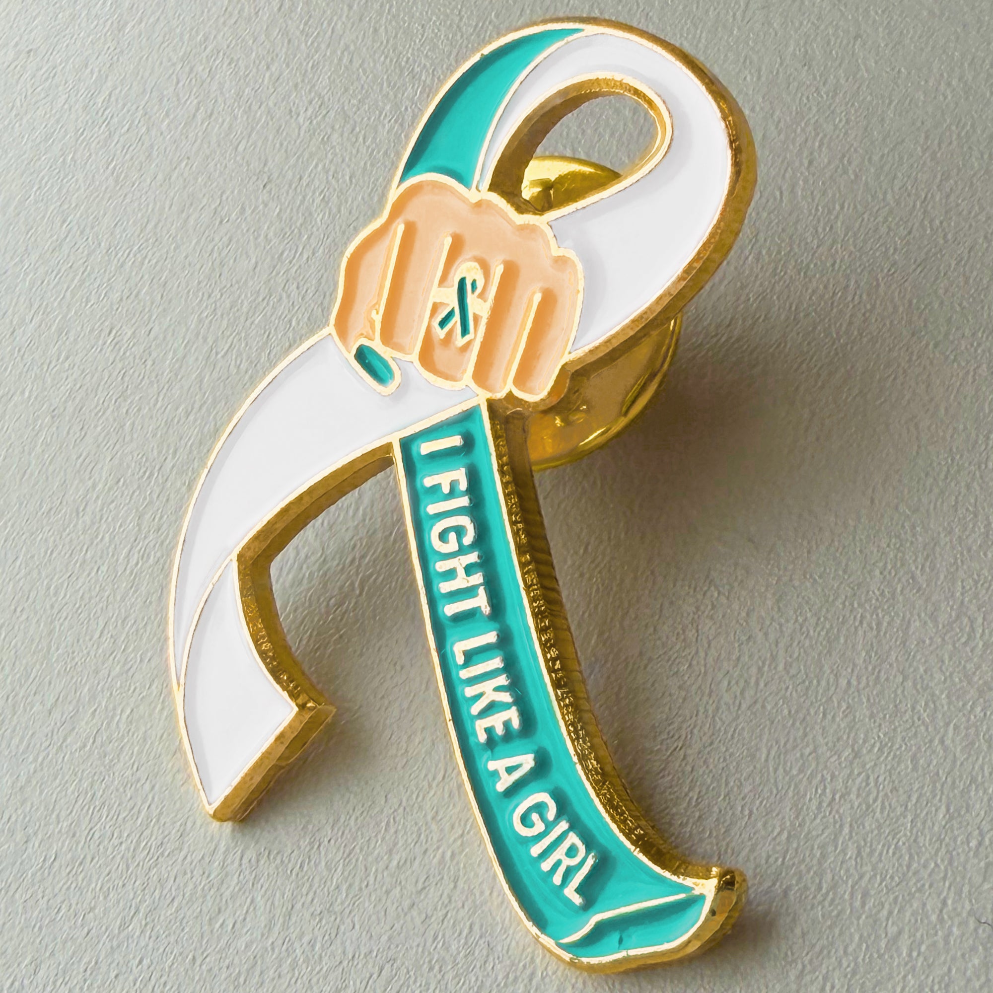I Fight Like a Girl Fist Awareness Ribbon Lapel Pin - Teal/White