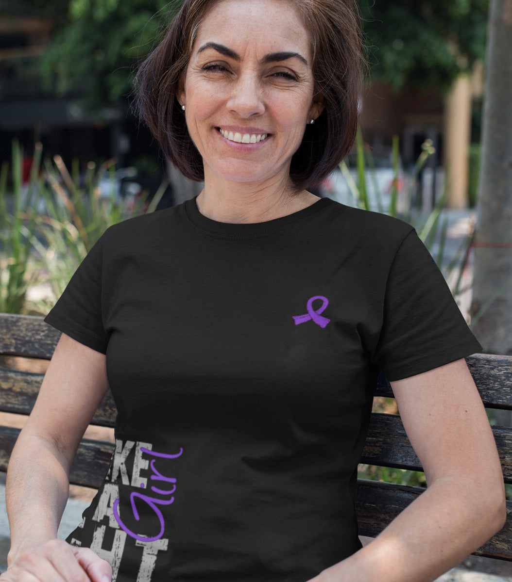 Woman wearing a black women's fit t-shirt with the Fight Like a Girl Side Wrap design in purple printed on it.