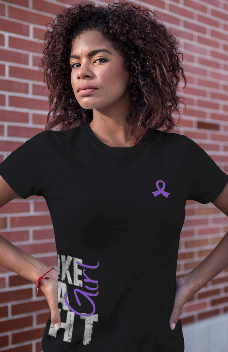 Woman wearing a black women's fit t-shirt with the Fight Like a Girl Side Wrap design in purple printed on it.