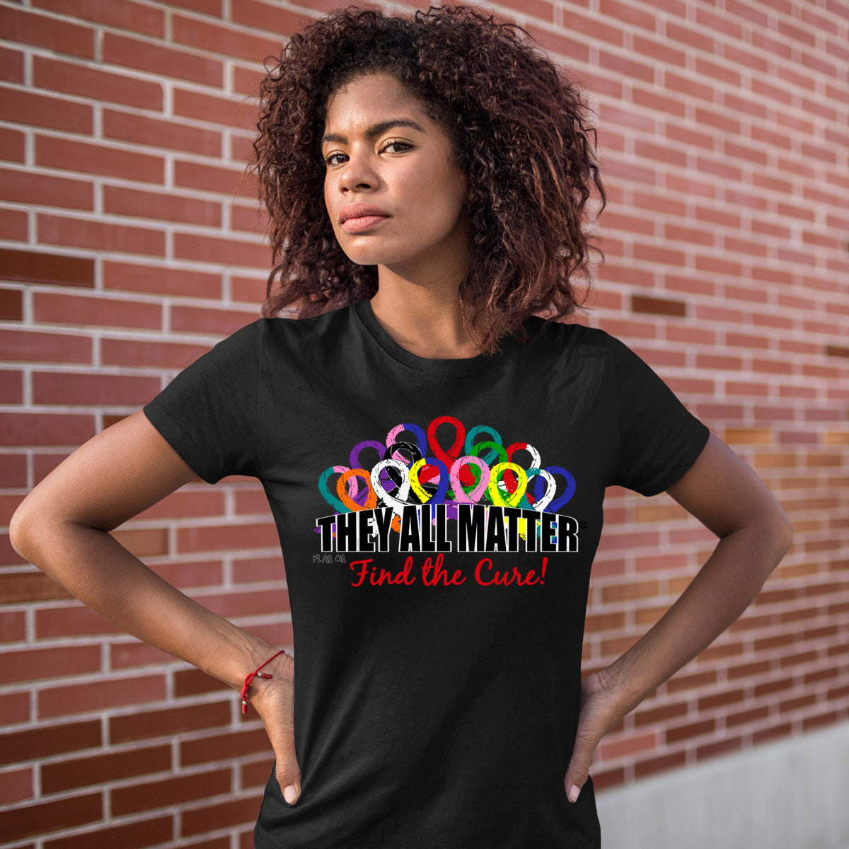Woman wearing a black women's fit t-shirt with the They All Matter design printed on it.